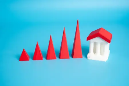 Une banque ou un bâtiment gouvernemental et une courbe de croissance ascendante. Macroéconomie