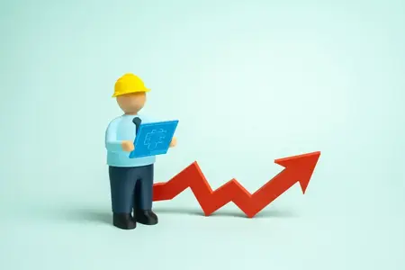 Un constructeur avec des plans et une flèche vers le haut. Construction accrue